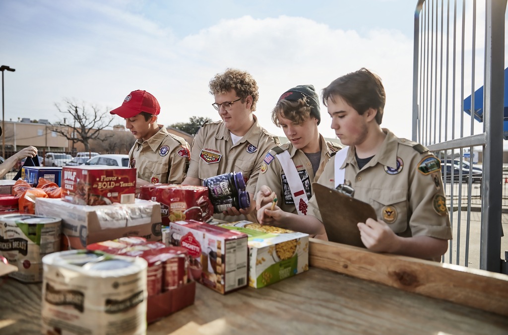 Four Scouts sort food donations