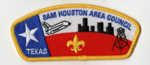 An image of the Sam Houston Area Council shoulder patch. The patch features the Lone Star, a space shuttle, the Houston Skyline, and an oil tower.