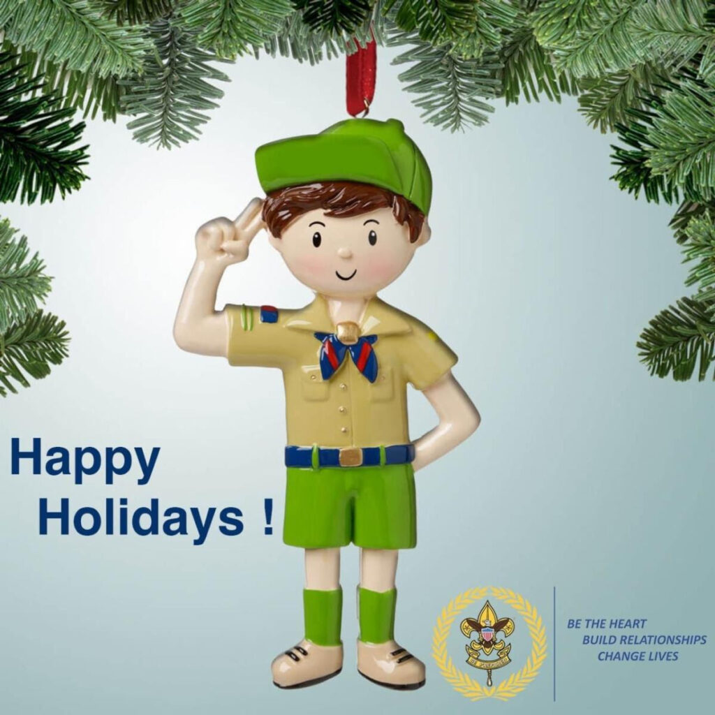 a ornament figurine of a Scout in uniform, saluting with the Scout salute