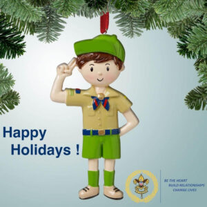 a ornament figurine of a Scout in uniform, saluting with the Scout salute
